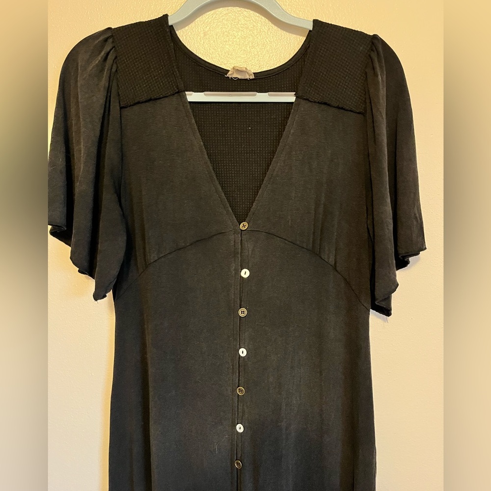 Flowy button up black dress.